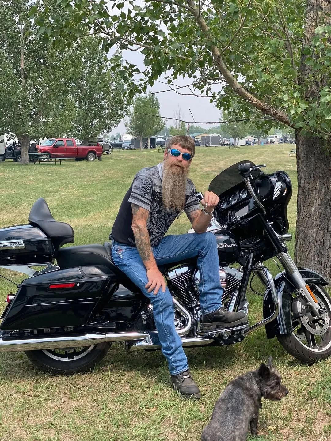 Scott Lind, owner of Scott Lind Electric LLC, seated on his Harley-Davidson